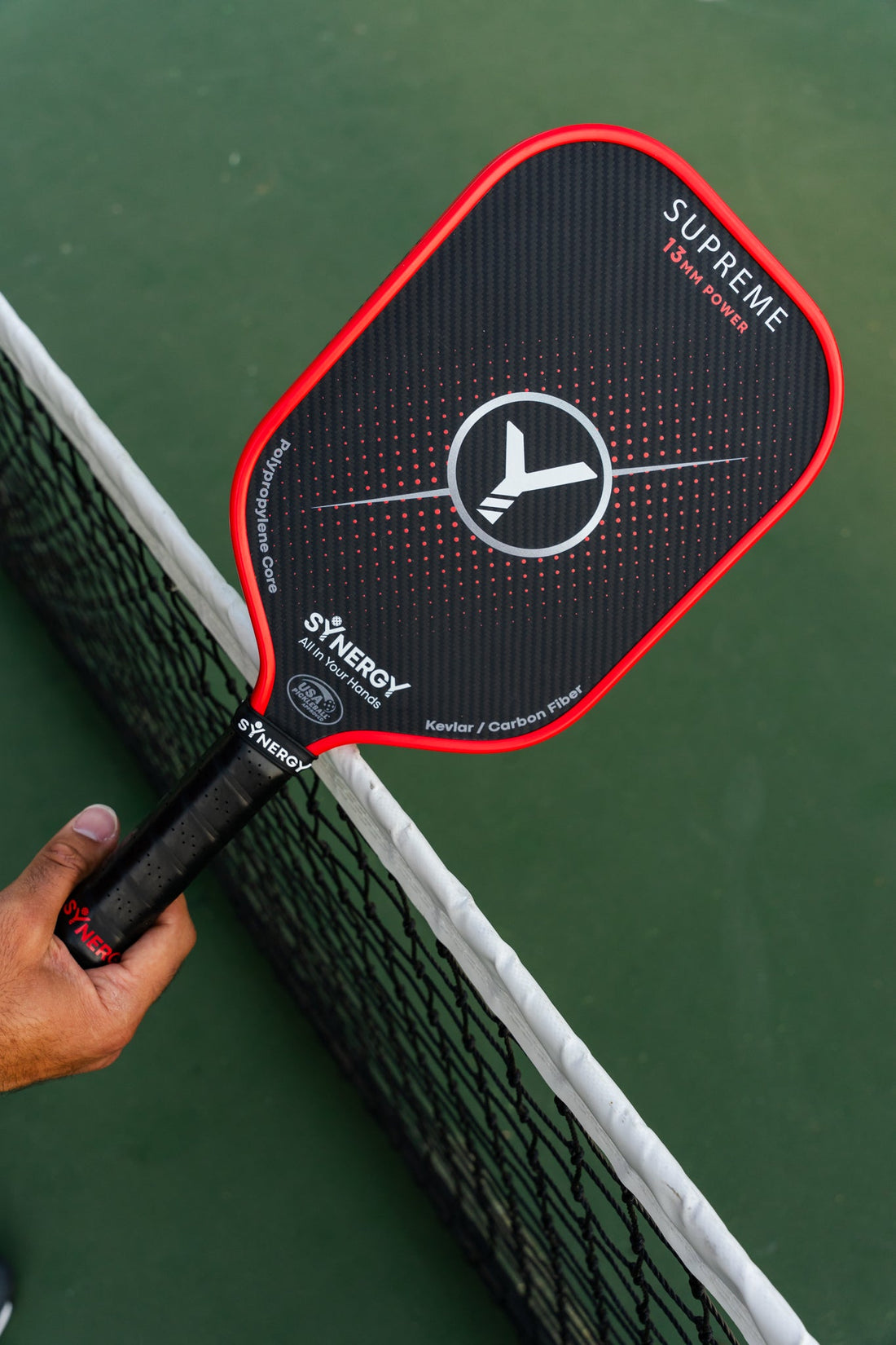 Synergy SUPREME 13mm pickleball paddle in real court photography