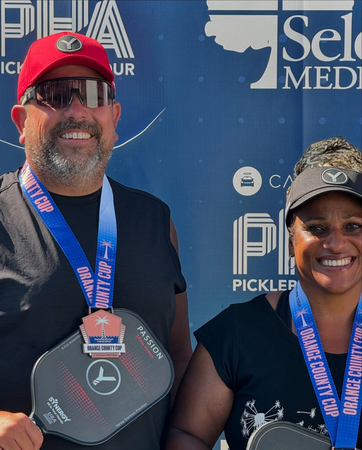 Real Synergy players celebrating at a pickleball tournament