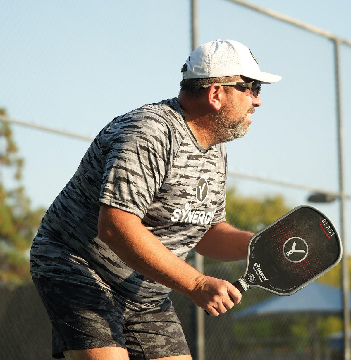 Real player competing outdoors with a Synergy paddle